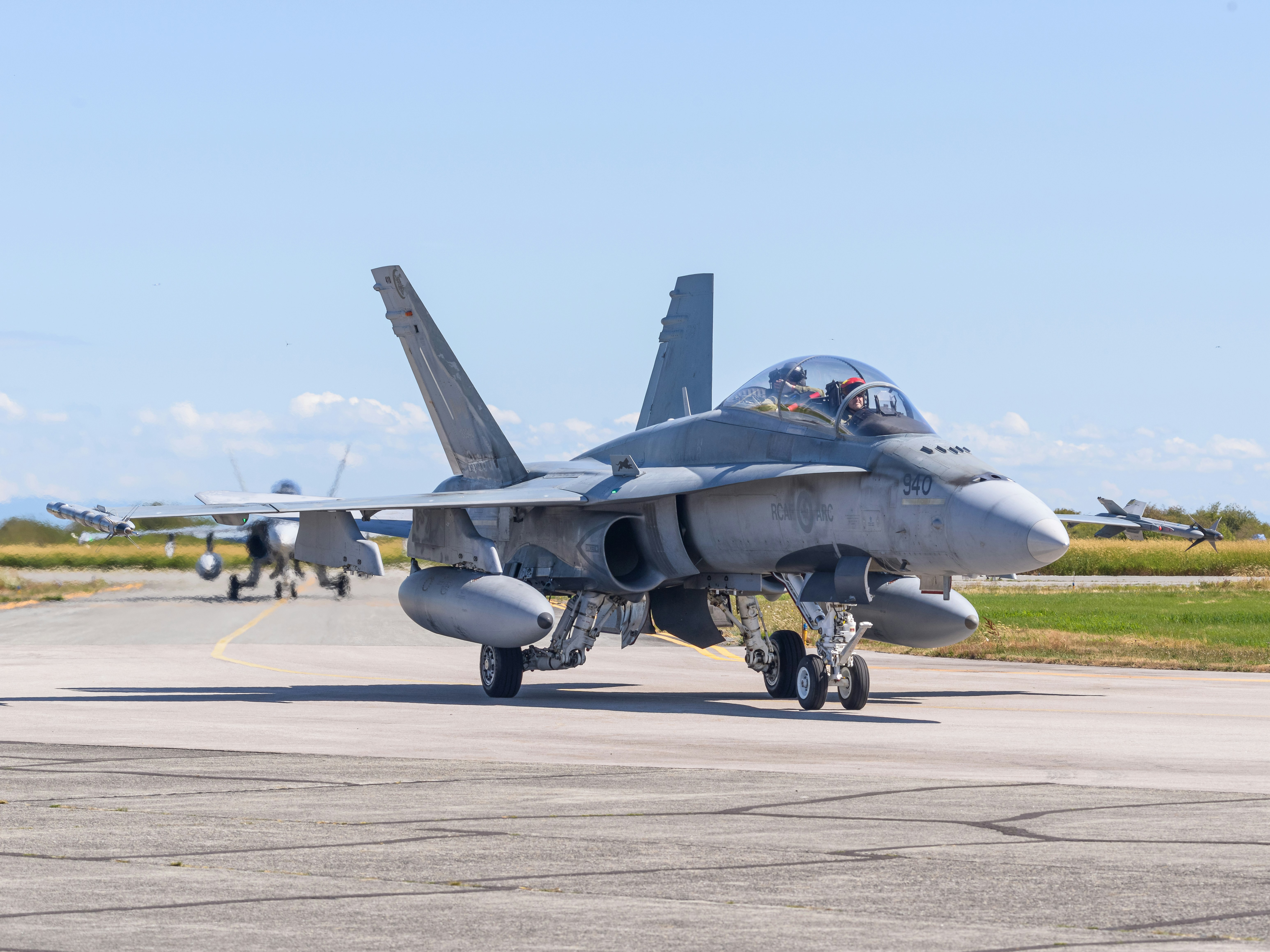 Two CF-18 Hornets taxi'ing from the Runway at the Boundary Bay Airshow